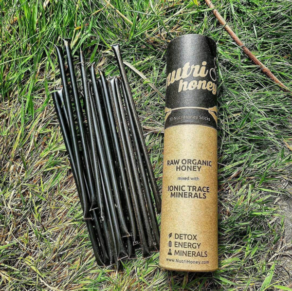 Nutrihoney canister and tubes in grass